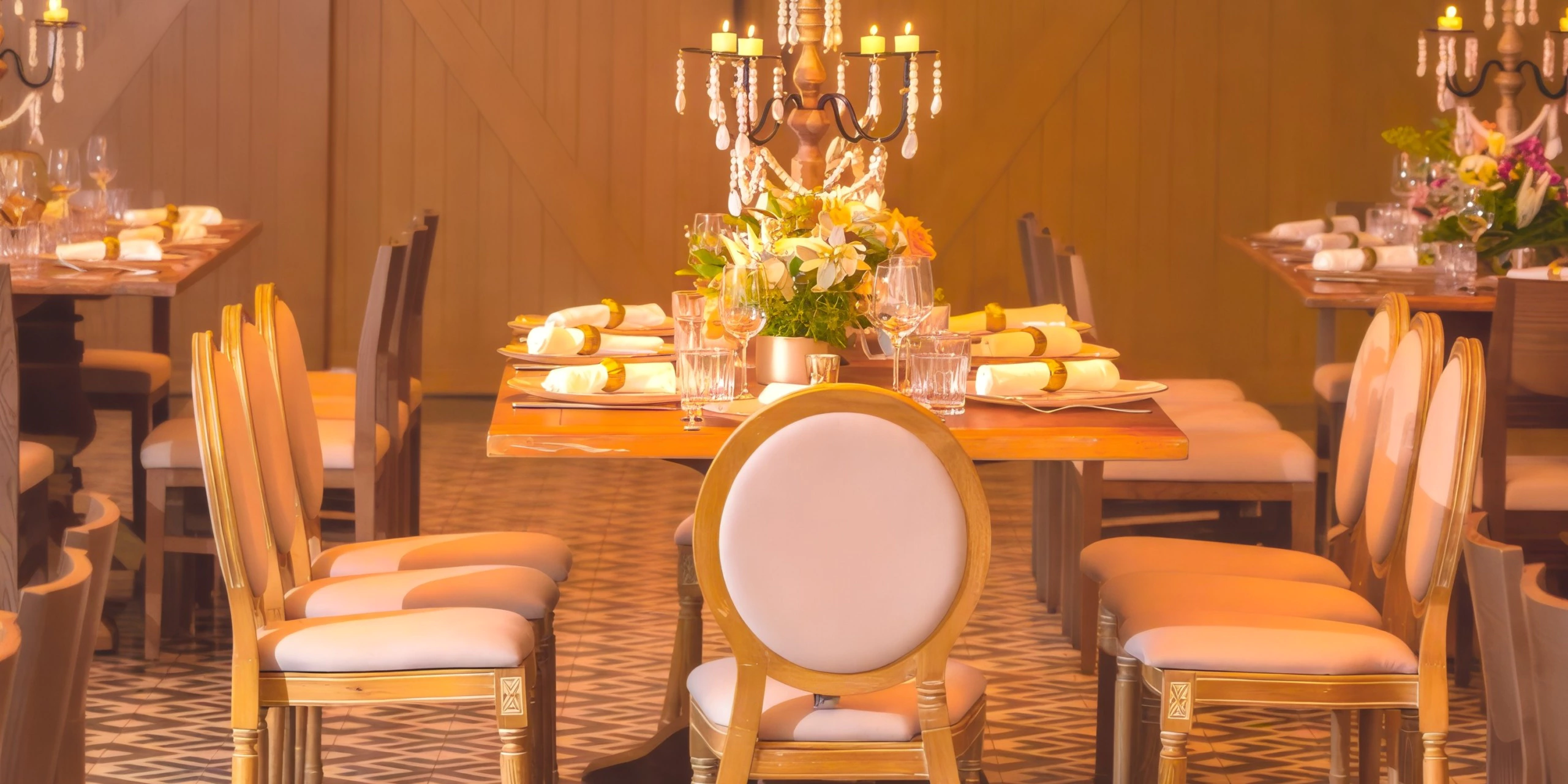Elegant indoor reception setup with candlelit candelabras at The Restaurant venue at Dreams Cap Cana Resort & Spa