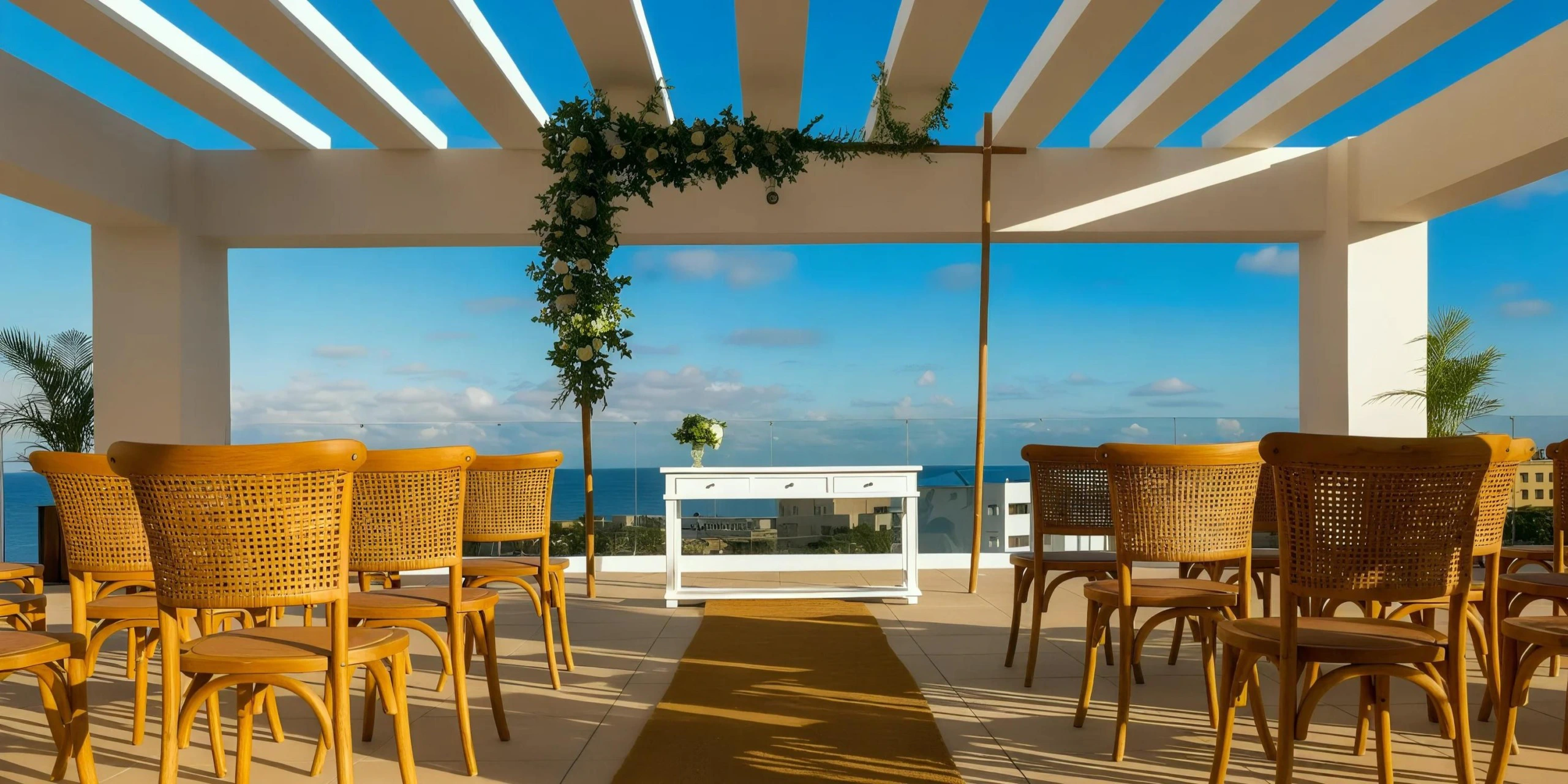 Sky Deck rooftop wedding ceremony setup with ocean views at Dreams Cap Cana Resort & Spa