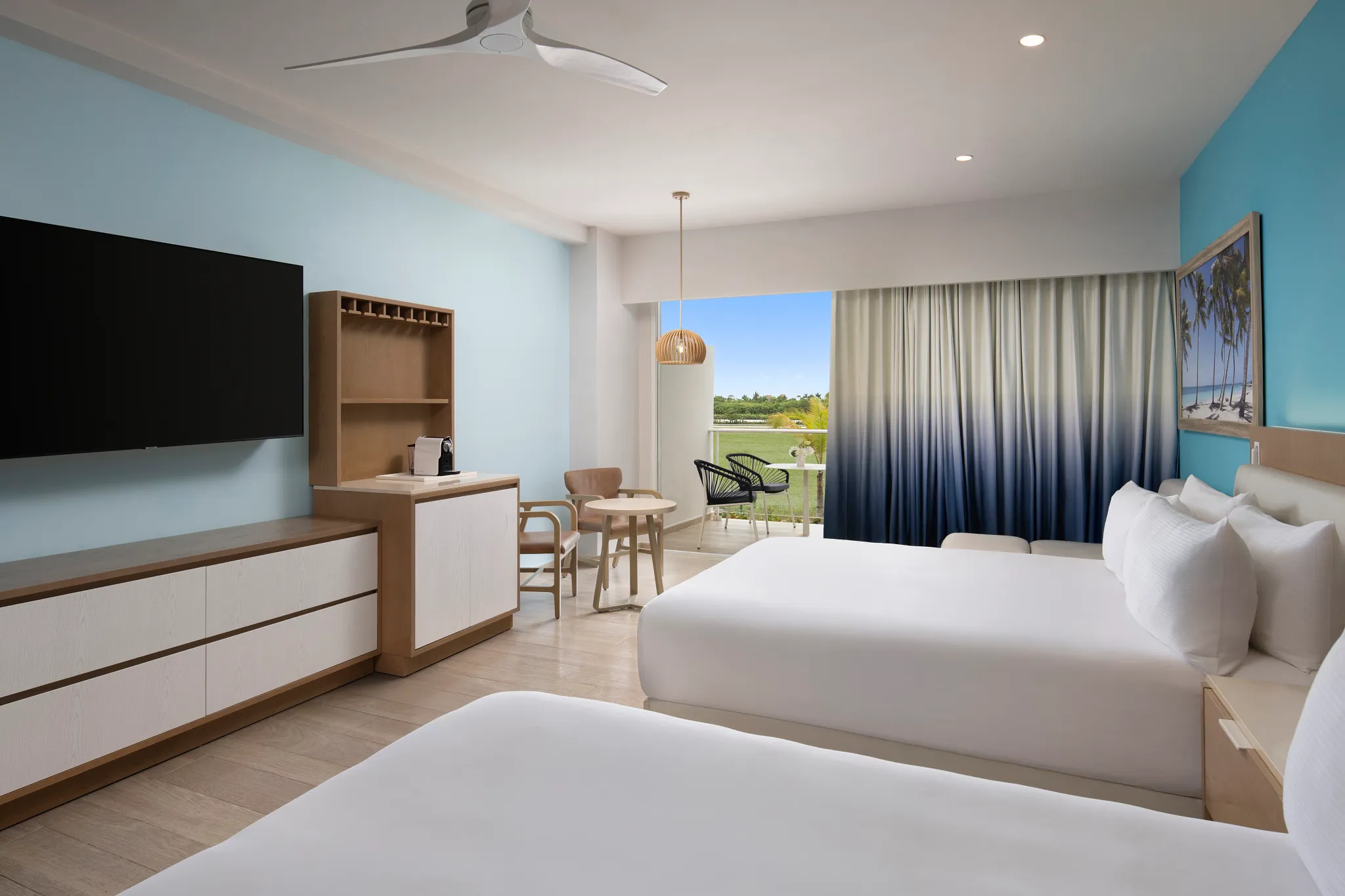 Allure-style Garden View room with two queen beds and private balcony overlooking tropical greenery at Dreams Cap Cana Resort & Spa.