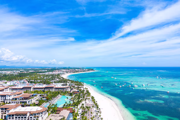 Punta Cana Beach near Dreams Cap Cana Resort & Spa with scenic palm-lined shores and clear Caribbean waters