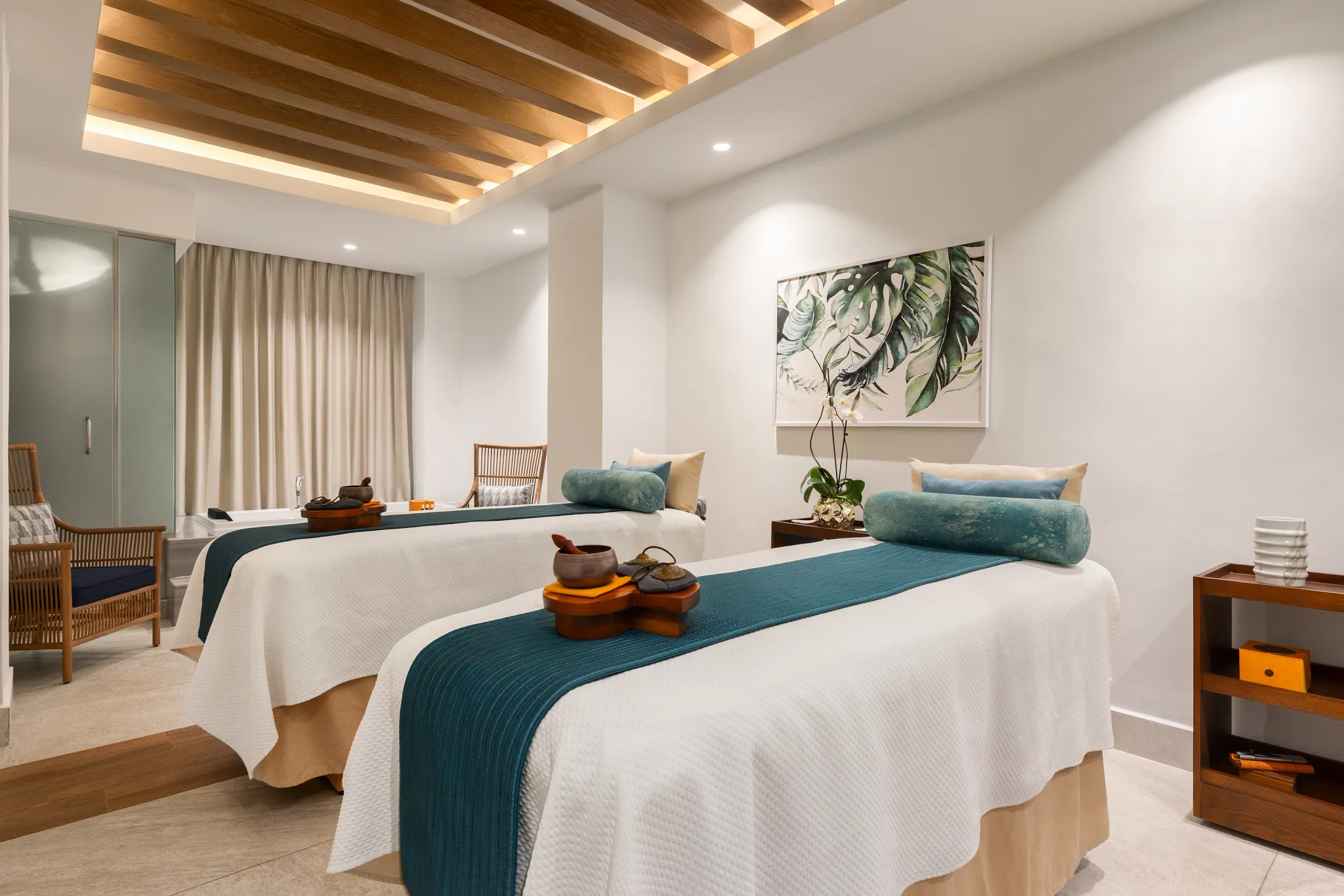 Dual massage beds inside a tranquil spa treatment room at Dreams Cap Cana Resort & Spa in Punta Cana.